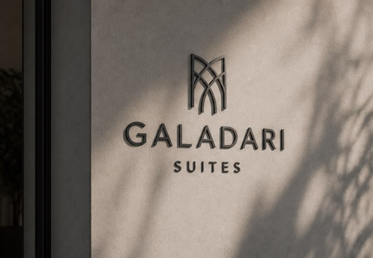 Galadari Suites signage on a stone wall